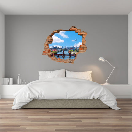 Wandaufkleber Wandtattoo in Form eines Wanddurchbruchs von der Berliner Skyline mit Fernsehturm und Oberbaumbrücke als Hauptbild im Schlafzimmer über dem Bett