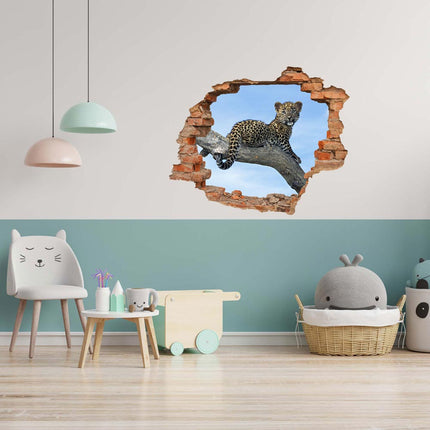 Wandaufkleber Wandtattoo in Form eines Wanddurchbruchs  von einem Leopardenbaby als Hauptbild im Kinderzimmer über der Spieleecke