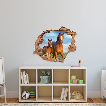 Wandaufkleber Wandtattoo in Form eines Wanddurchbruchs  von einem Pferd mit Fohlen als Hauptbild über dem Spielzeugregal im Kinderzimmer
