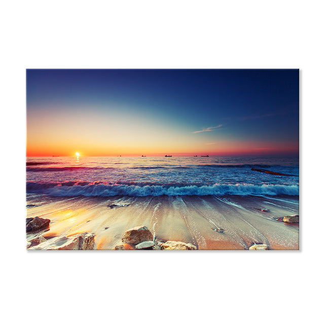 Romantisches Leinwandbild eines Sonnenaufgangs am Strand, mit intensiven Farben und einem atemberaubenden Zusammenspiel von Orange und Blau.