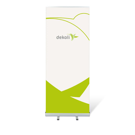 Roll-Up Banner Classic Premium mit grünem Dekoli Logo auf weißem  Hintergrund und abstrakter Grafik, montiert auf einem mobilen Standfuß, für effektive Präsentationen in Innenräumen.