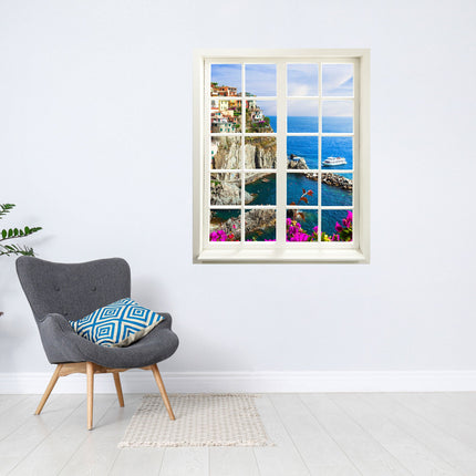 Wandaufkleber Wandtattoo in Form eines geschlossenen Fensters mit Blick auf die Bucht von Cinque Terre neben einem grauen Sessel