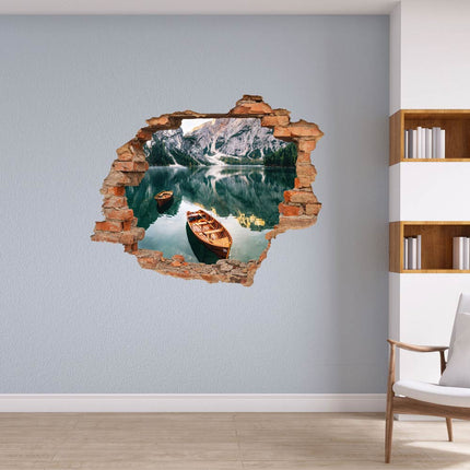 Wandaufkleber Wandtattoo in Form eines Wanddurchbruchs mit zwei Booten auf dem See und Berge im Hintergrund als Hauptbild neben dem Bücherregal