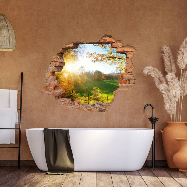 Wandaufkleber Wandtattoo in Form eines Wanddurchbruchs  von einer Waldlichtung als Hauptbild im Badezimmer an einer orangenen Wand über der Badewanne