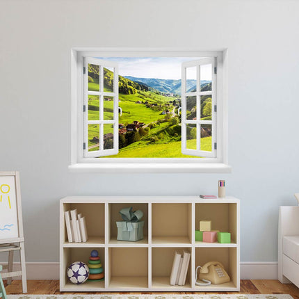 Selbstklebendes Wandbild in Form eines geöffneten weißen Fensters, aufgehangen über einem Regal im Kinderzimmer, bietet eine beruhigende Illusion mit Blick auf ein Tal mit Wohnhäusern und eine malerische Landschaft.