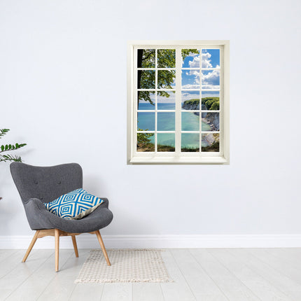 Wandtattoo Motiv Fensterblick "Meer und Bucht" in hellem Raum neben grauem Sessel